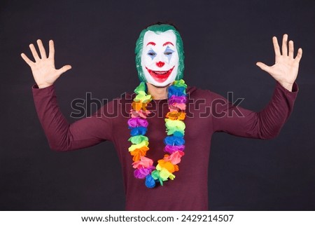 man dressed as a joker for carnival.