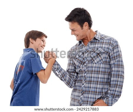 Father, arm wrestle and child with strength for game of power or playful bonding on a white studio background. Dad, son or kid with friendly handshake in battle for challenge, parenting or childhood