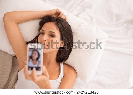Woman, selfie and above in bed with pillow on vacation, hotel and relax for photography on web blog. Girl, person and influencer for profile picture, home or live streaming in bedroom on social media