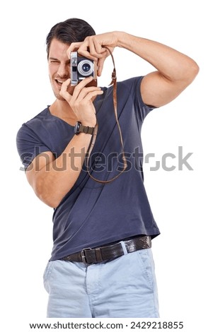 Photographer, picture and vintage camera with casual man in studio isolated on white background for hobby. Art, creative or media and young photography person with focus lens for photo shoot