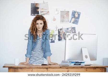 Business, woman and portrait at creative desk and office for planning of startup project or online magazine. Portrait of young worker and visual editor or graphic designer of website or social media