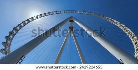 Summertime Wide Angle Details on the Ferris Wheel metal Beams and Passenger Capsule Booths. Dubai Eye on Bluewater Island Royalty-Free Stock Photo #2429224655