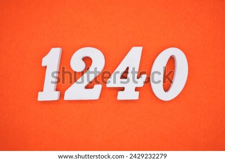 Orange felt is the background. The numbers 1240 are made from white painted wood.