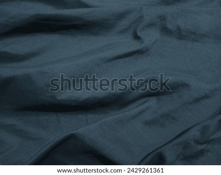 Wondering if this blue fabric is soft to the touch or more textured? I'm intrigued by the different types of clothing materials out there.