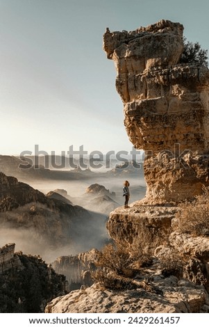 
Unrecognizable vacationer standing beneath a jagged precipice in the Alps
 Royalty-Free Stock Photo #2429261457