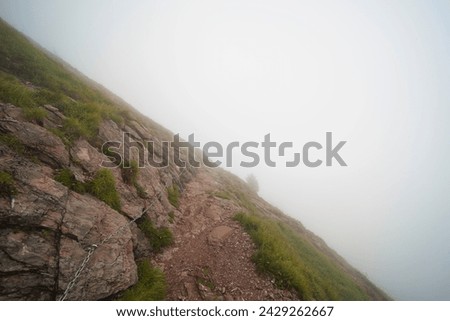 Hiking trail on the ,,Grosser Mythen" a beautiful mountain 1,898 m high in the canton of Schwyz in Switzerland.  Royalty-Free Stock Photo #2429262667