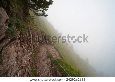 Hiking trail on the ,,Grosser Mythen" a beautiful mountain 1,898 m high in the canton of Schwyz in Switzerland.  Royalty-Free Stock Photo #2429262683