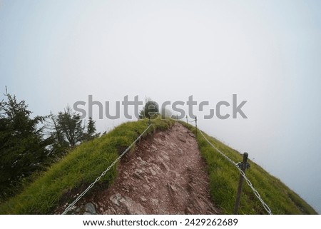 Hiking trail on the ,,Grosser Mythen" a beautiful mountain 1,898 m high in the canton of Schwyz in Switzerland.  Royalty-Free Stock Photo #2429262689
