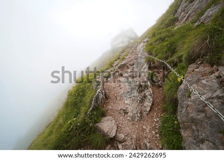 Hiking trail on the ,,Grosser Mythen" a beautiful mountain 1,898 m high in the canton of Schwyz in Switzerland.  Royalty-Free Stock Photo #2429262695