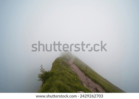 Hiking trail on the ,,Grosser Mythen" a beautiful mountain 1,898 m high in the canton of Schwyz in Switzerland.  Royalty-Free Stock Photo #2429262703