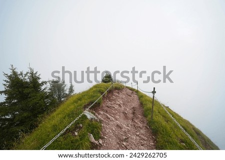 Hiking trail on the ,,Grosser Mythen" a beautiful mountain 1,898 m high in the canton of Schwyz in Switzerland.  Royalty-Free Stock Photo #2429262705