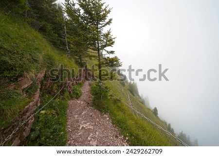 Hiking trail on the ,,Grosser Mythen" a beautiful mountain 1,898 m high in the canton of Schwyz in Switzerland.  Royalty-Free Stock Photo #2429262709