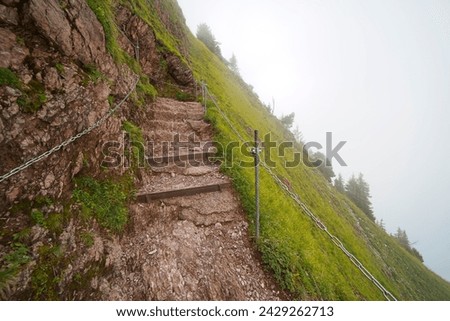 Hiking trail on the ,,Grosser Mythen" a beautiful mountain 1,898 m high in the canton of Schwyz in Switzerland.  Royalty-Free Stock Photo #2429262713