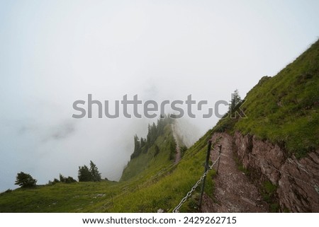 Hiking trail on the ,,Grosser Mythen" a beautiful mountain 1,898 m high in the canton of Schwyz in Switzerland.  Royalty-Free Stock Photo #2429262715