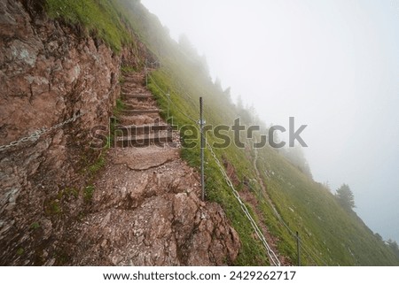 Hiking trail on the ,,Grosser Mythen" a beautiful mountain 1,898 m high in the canton of Schwyz in Switzerland.  Royalty-Free Stock Photo #2429262717