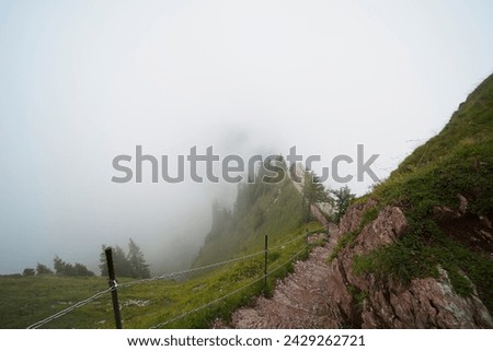 Hiking trail on the ,,Grosser Mythen" a beautiful mountain 1,898 m high in the canton of Schwyz in Switzerland.  Royalty-Free Stock Photo #2429262721