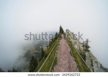 Hiking trail on the ,,Grosser Mythen" a beautiful mountain 1,898 m high in the canton of Schwyz in Switzerland.  Royalty-Free Stock Photo #2429262723