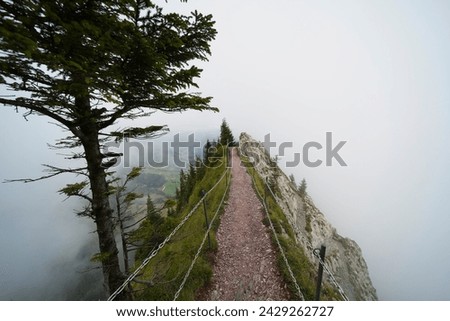 Hiking trail on the ,,Grosser Mythen" a beautiful mountain 1,898 m high in the canton of Schwyz in Switzerland.  Royalty-Free Stock Photo #2429262727