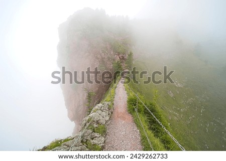 Hiking trail on the ,,Grosser Mythen" a beautiful mountain 1,898 m high in the canton of Schwyz in Switzerland.  Royalty-Free Stock Photo #2429262733