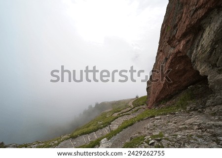 Hiking trail on the ,,Grosser Mythen" a beautiful mountain 1,898 m high in the canton of Schwyz in Switzerland.  Royalty-Free Stock Photo #2429262755