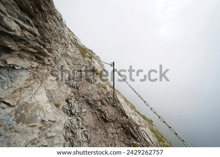 Hiking trail on the ,,Grosser Mythen" a beautiful mountain 1,898 m high in the canton of Schwyz in Switzerland.  Royalty-Free Stock Photo #2429262757