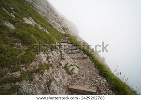 Hiking trail on the ,,Grosser Mythen" a beautiful mountain 1,898 m high in the canton of Schwyz in Switzerland.  Royalty-Free Stock Photo #2429262763