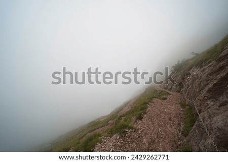 Hiking trail on the ,,Grosser Mythen" a beautiful mountain 1,898 m high in the canton of Schwyz in Switzerland.  Royalty-Free Stock Photo #2429262771
