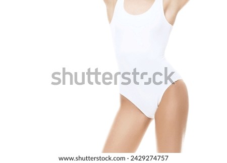 Young, fit and beautiful woman in white swimsuit over white background. Healthcare, diet, sport and fitness concept.
