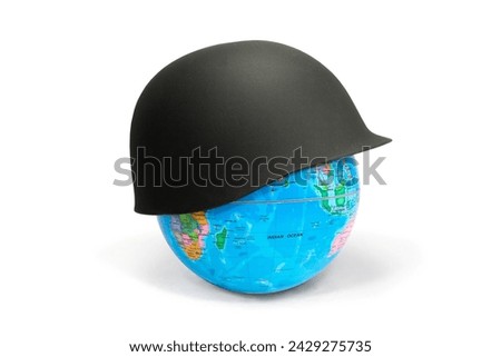 Earth Globe covered with a soldier's helmet showing Africa and Australia: war concept. The soldier's helmet symbolizes war and war conflicts that lead to death and destruction. Royalty-Free Stock Photo #2429275735
