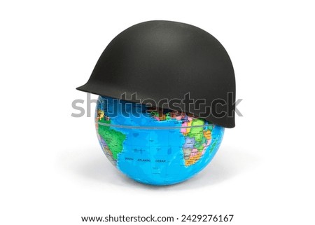 Earth Globe covered with a soldier's helmet where you can see Africa and America: war concept. The soldier's helmet symbolizes war and war conflicts that lead to death and destruction. Royalty-Free Stock Photo #2429276167