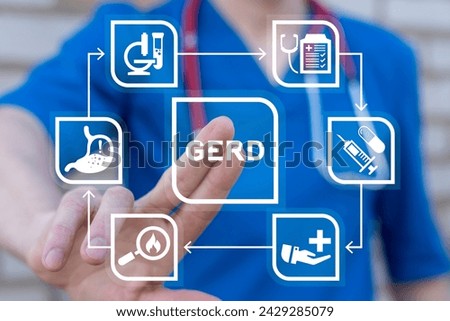 Doctor using virtual touch screen presses abbreviation: GERD. Gastroesophageal Reflux Disease ( GERD ) or acid reflux symptoms medical concept. Gastrointestinal system disease and digestive problems. Royalty-Free Stock Photo #2429285079