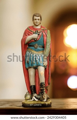 Statue of Saint Expedite in  blurred religious church background Royalty-Free Stock Photo #2429304405
