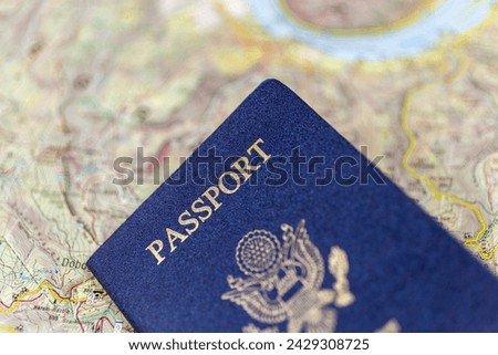 United States passport on an old paper map.