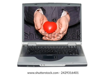 Lap Top Computer. Heart in Hand. A Human Hand holds a Valentines Day Red Heart. Internet Love Match. Online Dating Site. Romance. Peace and Love. Dating Site. www. World Wide Web. Computer Dating. Luv