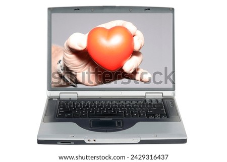 Lap Top Computer. Heart in Hand. A Human Hand holds a Valentines Day Red Heart. Internet Love Match. Online Dating Site. Romance. Peace and Love. Dating Site. www. World Wide Web. Computer Dating. Luv