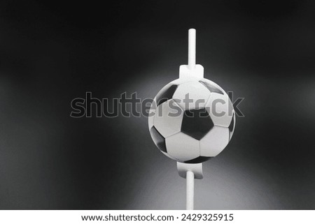 Soccer straw for drinks on white background