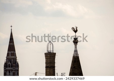 Temple towers of Szeged city with weathercock from the water tower Royalty-Free Stock Photo #2429337469