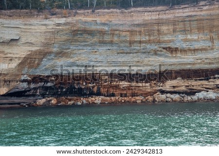 Munising, Michigan. Pictured Rocks National Lakeshore on Lake Superior in the Upper Peninsula of Michigan. The colors in the cliffs are created by the large amounts of minerals in the rock. 