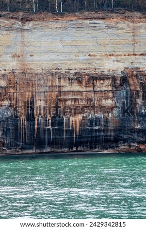 Munising, Michigan. Pictured Rocks National Lakeshore on Lake Superior in the Upper Peninsula of Michigan. The colors in the cliffs are created by the large amounts of minerals in the rock. 