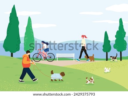 People enjoying walks with their dogs in a riverside park and people exercising on the trails Royalty-Free Stock Photo #2429375793