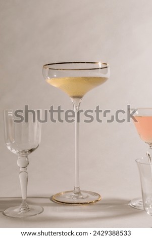 cocktail glasses, champagne coupe against white
