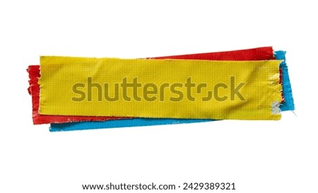 Layered yellow, red and blue cloth tapes on white background with clipping path