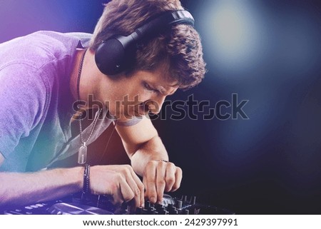 The dedication of a DJ at work is captured as he meticulously adjusts the mixer controls