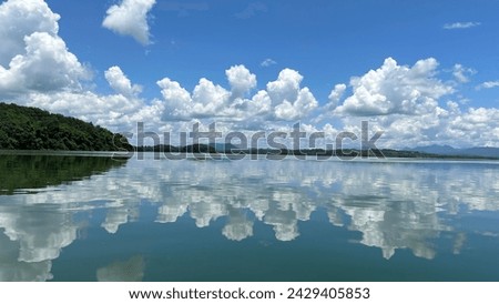 Sky reflection in riam kanan reservoir Banjarmasin Royalty-Free Stock Photo #2429405853