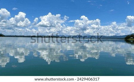 Sky reflection in riam kanan reservoir Banjarmasin Royalty-Free Stock Photo #2429406317