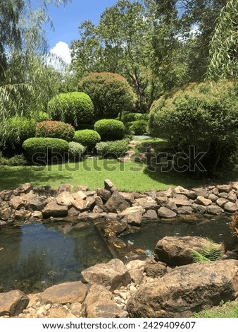 path in the Japanese-style garden and its decorated flowers and green stuff Royalty-Free Stock Photo #2429409607