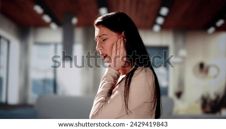 Hearing Aid And Painful Ear Ache. Hearing Issue Royalty-Free Stock Photo #2429419843