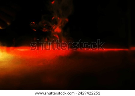 Red smoke over black studio background. Red steam on a black background.