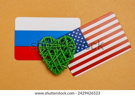 Heart and flag of Russia with the flag of the USA. Background with selective focus and copy space for text