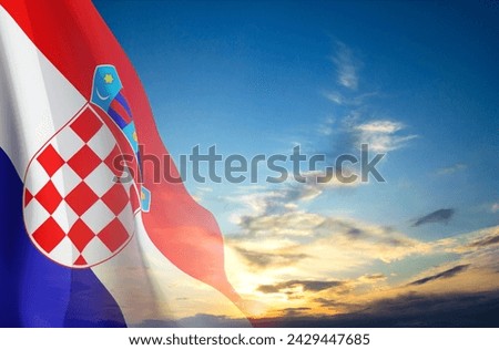 Flag of Croatia against the sunset sky